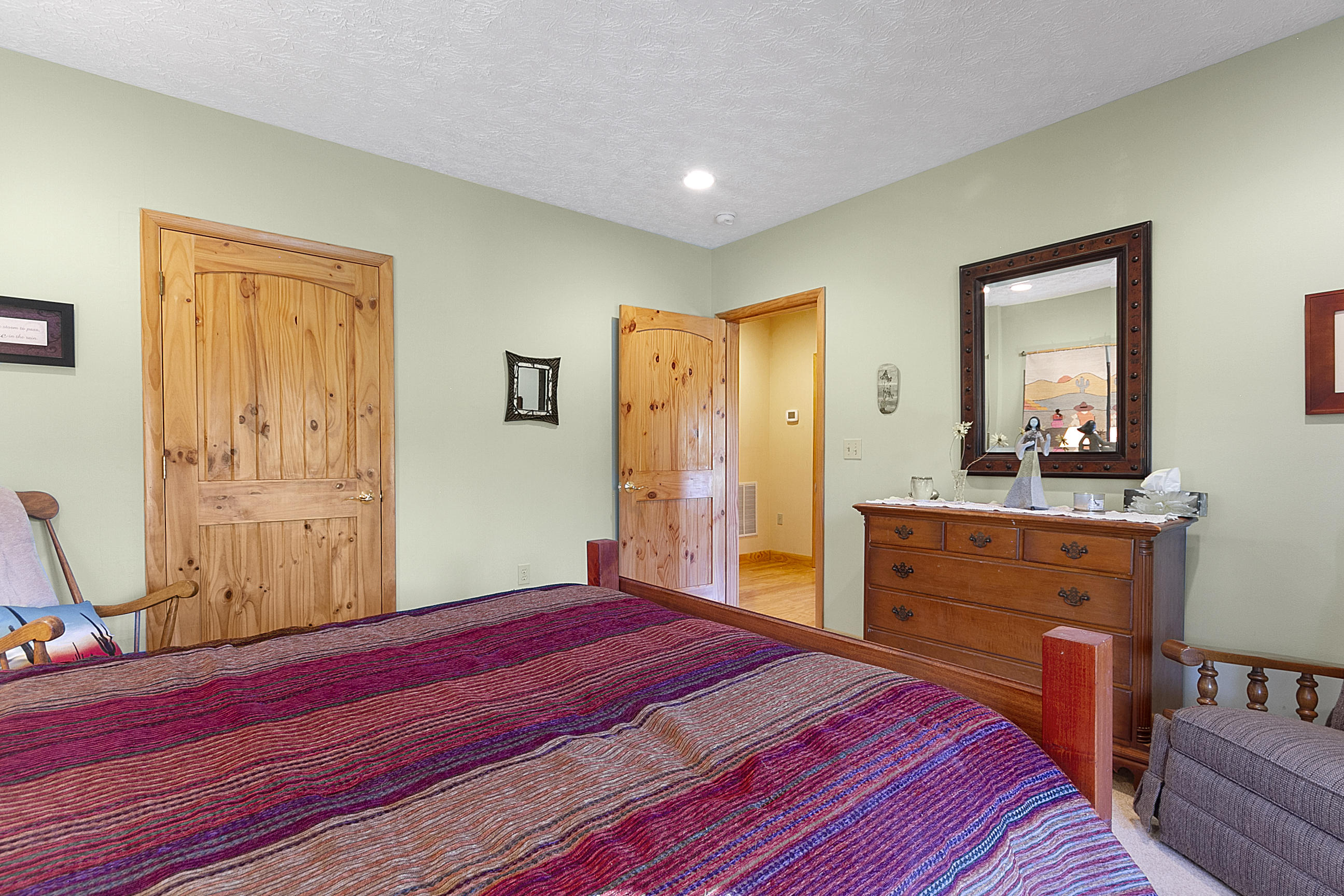 3950 Flatwoods Road Elliston, VA 24087 - Photo 84 of 94 a bedroom with a bed and a dresser in it
