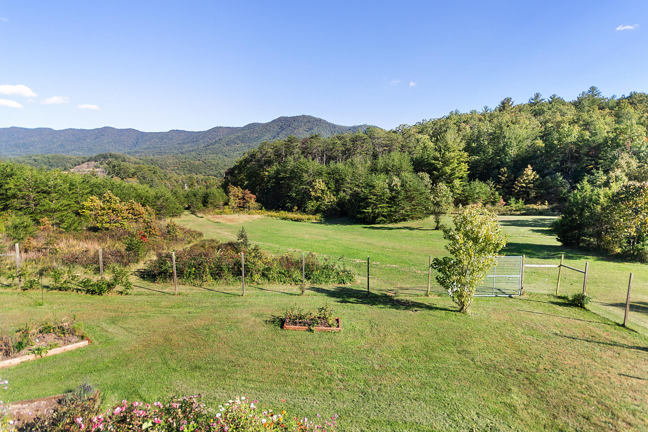 3950 Flatwoods Road Elliston, VA 24087 - Photo 93 of 94 a view of a lush green hillside and houses