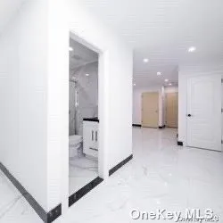 a kitchen with stainless steel appliances white cabinets and a stove top oven