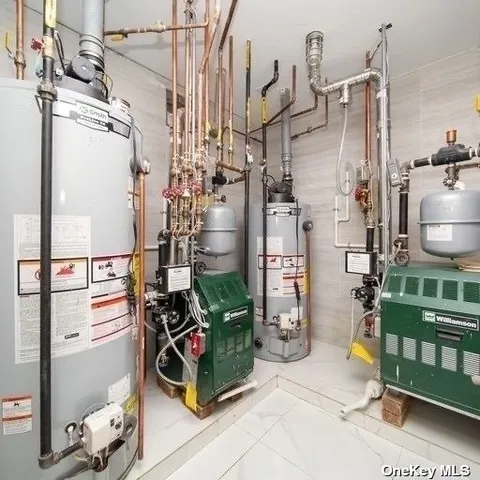 an empty room with a cabinet and a refrigerator