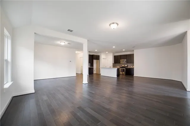 a view of kitchen with furniture and wooden floor