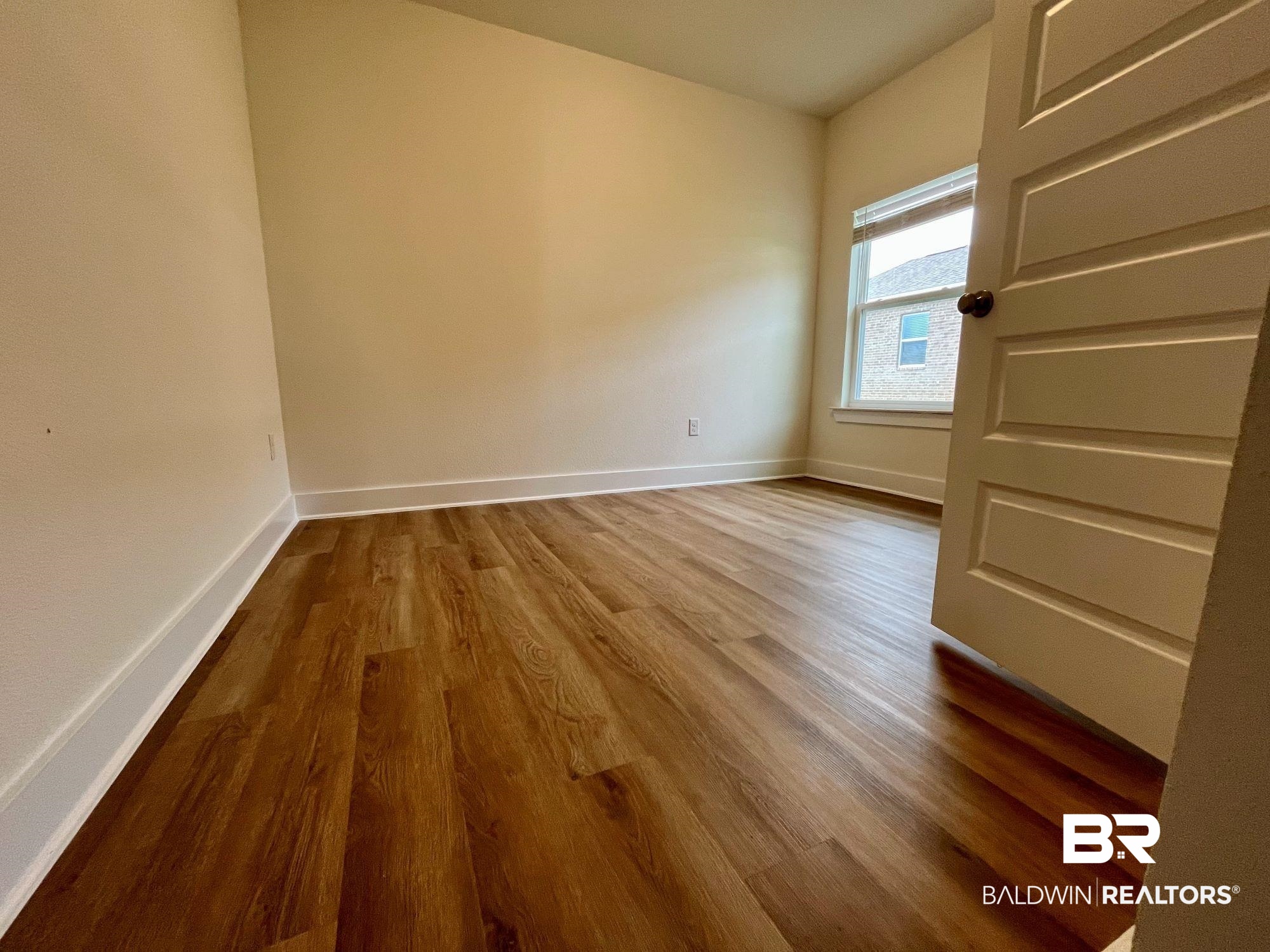 337 Barndling Street Fairhope, AL 36532 - Photo 22 of 34 Unfurnished room with wood-type flooring