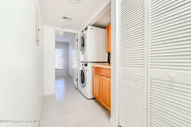 a view of a storage & utility room with washer and dryer