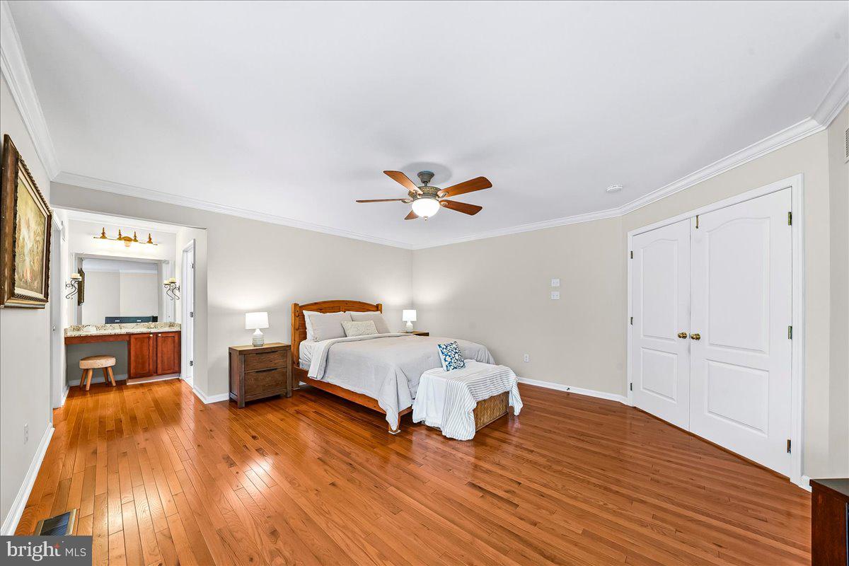408 Brentford Road Kennett Square, PA 19348 - Photo 22 of 41 a bedroom with a bed and wooden floor
