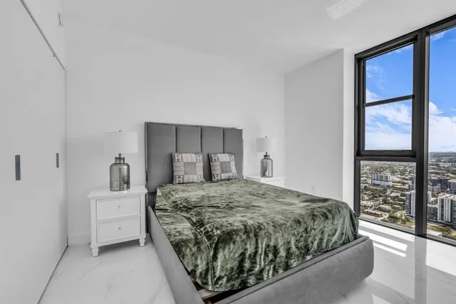 a room with furniture and a large window