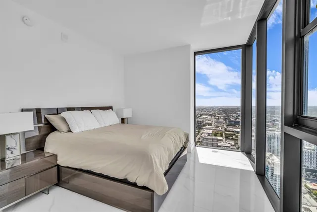 a view of a bathroom with a glass door shower and a bath tub