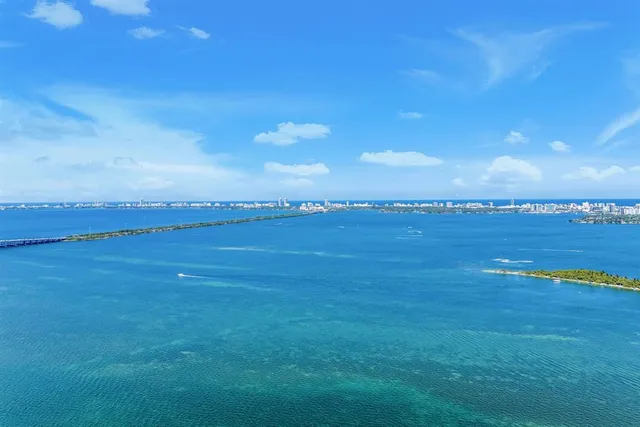 a bathroom with a bathtub and a shower curtain