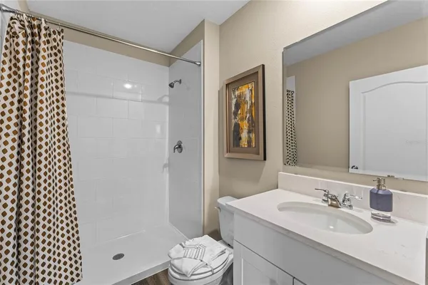 a view of a room with gym equipment and floor to ceiling windows