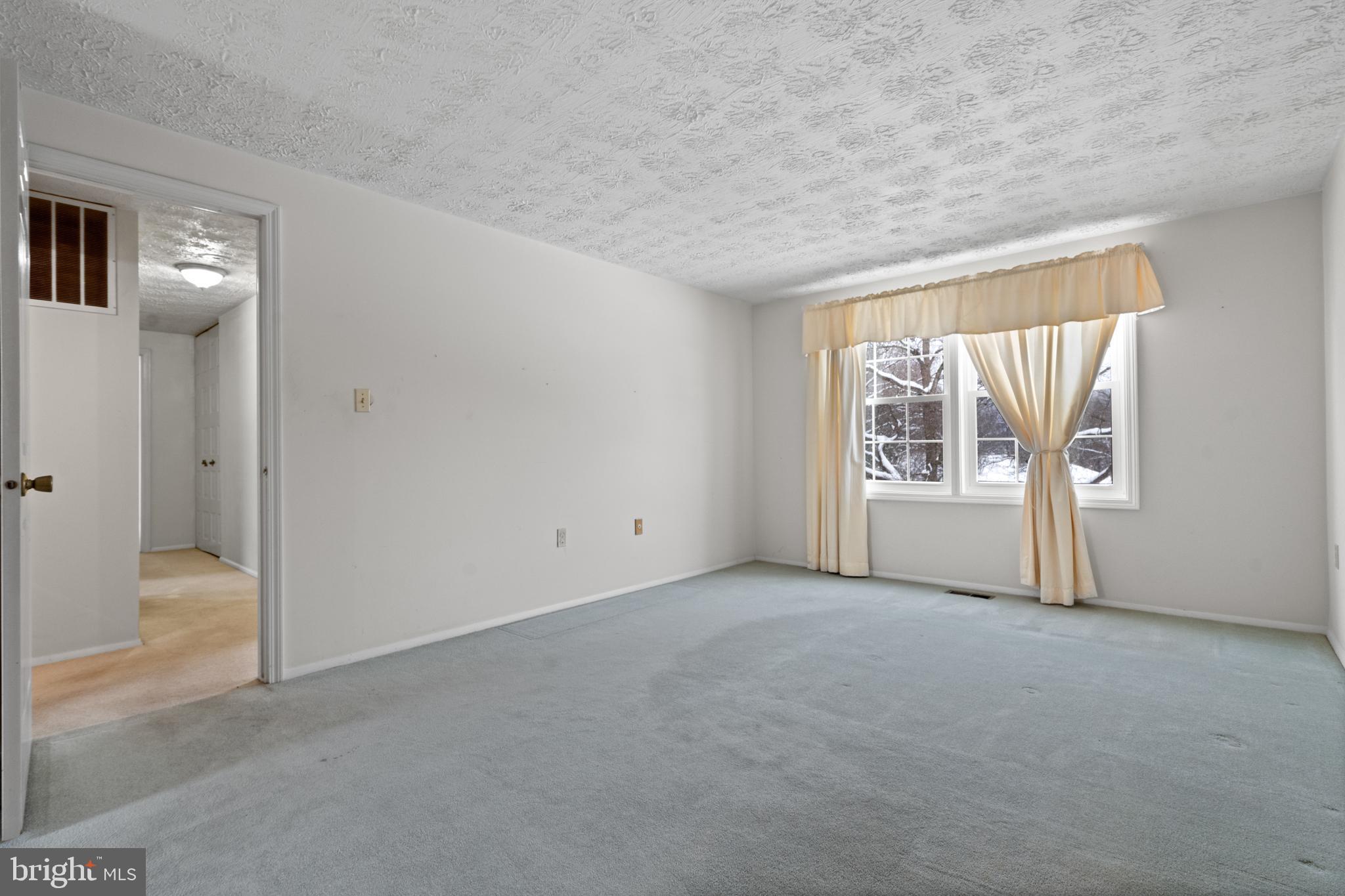 1111 Riva Ridge Drive Great Falls, VA 22066 - Photo 22 of 35 a view of an empty room with a window