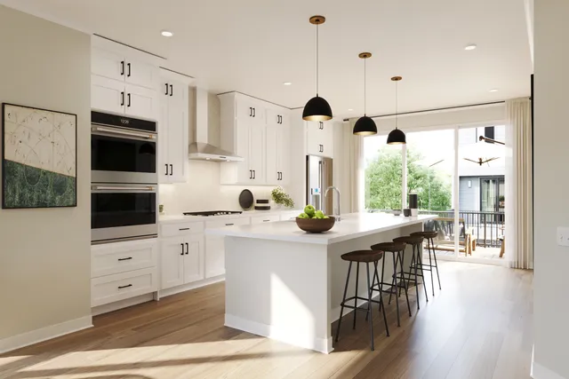 a kitchen with stainless steel appliances granite countertop a stove a sink a refrigerator and a dining table with wooden floor