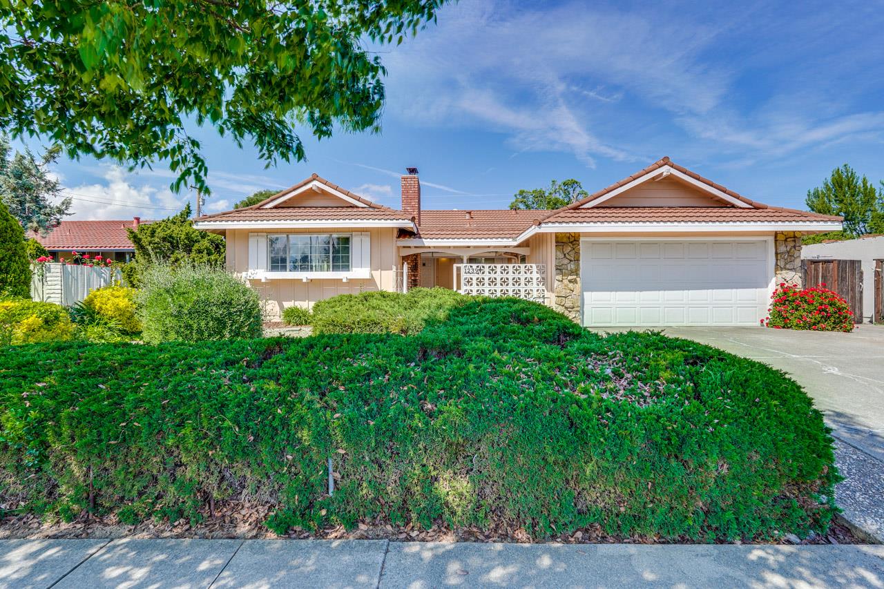 1239 Lockhaven Way San Jose, CA 95129 - Photo 1 of 1 a front view of a house with a yard and garage
