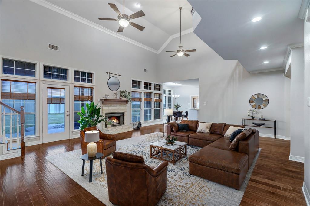 1810 Longbranch Road Waxahachie, TX 76065 - Photo 14 of 39 a living room with fireplace furniture and a wooden floor