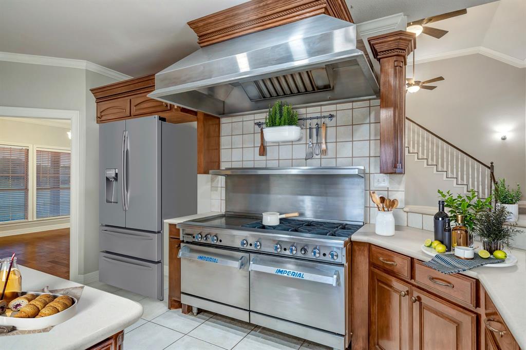 1810 Longbranch Road Waxahachie, TX 76065 - Photo 17 of 39 a kitchen with stainless steel appliances granite countertop a stove and a refrigerator