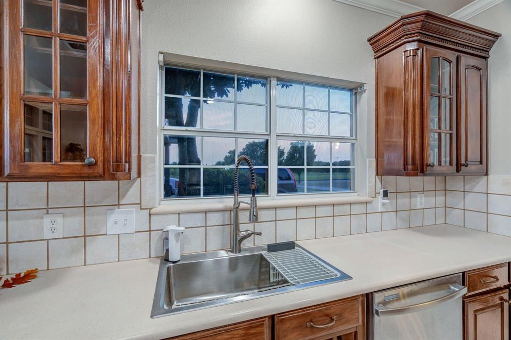 1810 Longbranch Road Waxahachie, TX 76065 - Photo 19 of 39 a kitchen with a sink and cabinets