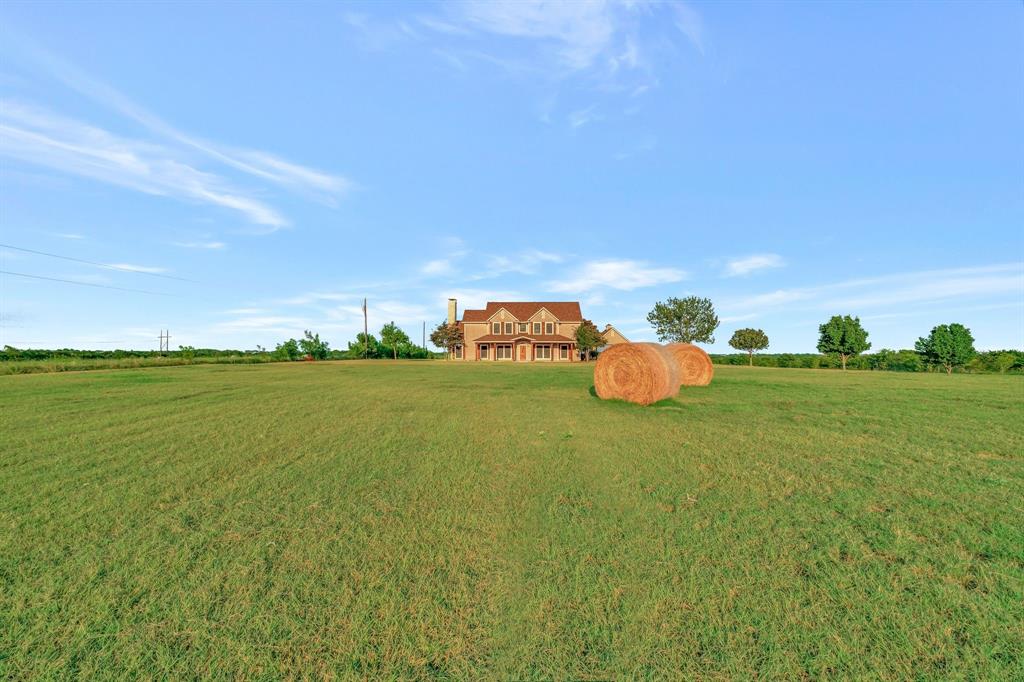 1810 Longbranch Road Waxahachie, TX 76065 - Photo 2 of 39 a front view of a house with a yard