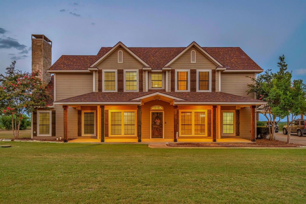 1810 Longbranch Road Waxahachie, TX 76065 - Photo 3 of 39 a front view of a house with a yard