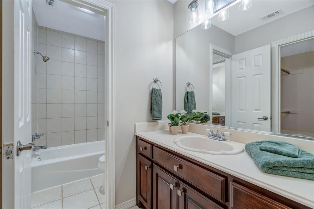 1810 Longbranch Road Waxahachie, TX 76065 - Photo 33 of 39 a bathroom with a granite countertop sink and a mirror