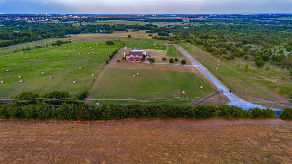 1810 Longbranch Road Waxahachie, TX 76065 - Photo 7 of 39 a view of a back yard of a house