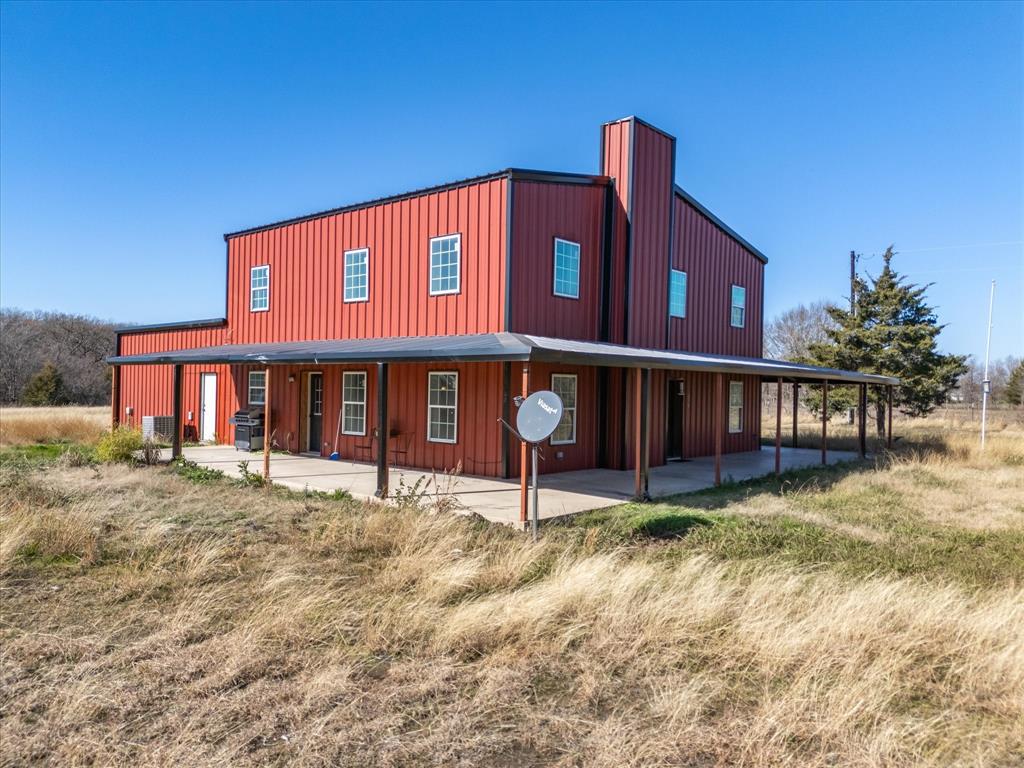 370 Hooper Cemetery Road Ennis, TX 75119 - Photo 1 of 1 a view of a house with a yard