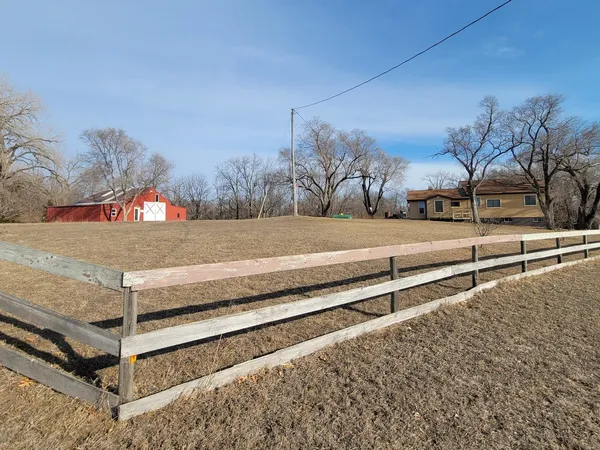 a view of a backyard of the house
