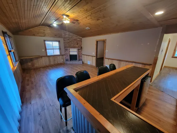 a view of an chairs and wooden floor