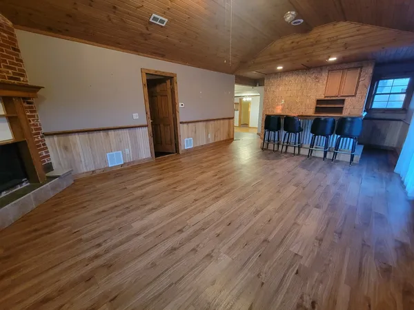 a view of kitchen with furniture and wooden floor