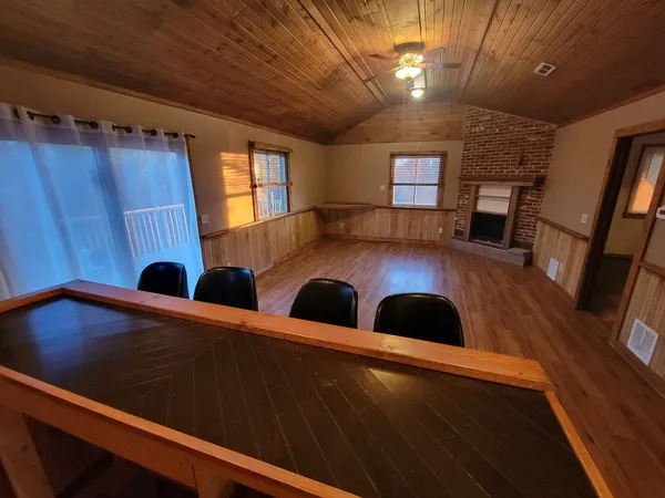 a view of kitchen and dining room with wooden floor