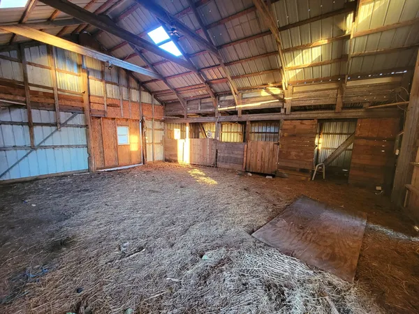 a view of a room with wooden walls