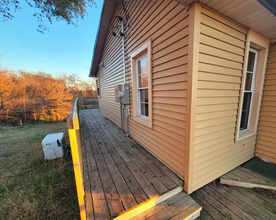 a view of a backyard with sitting area