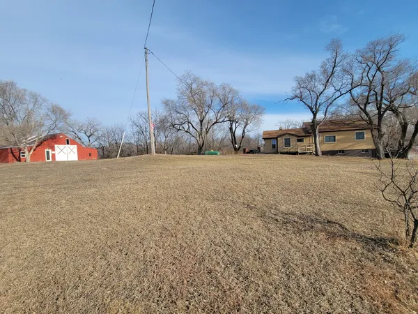a view of a yard with a house