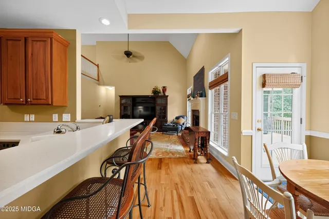 a view of a very nice looking living room with a large window with furniture