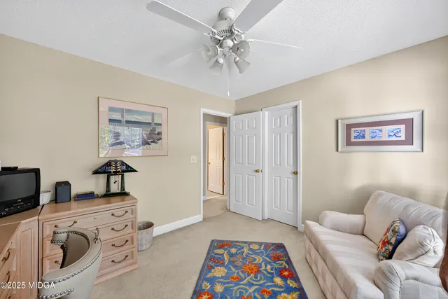 a bedroom with furniture and a chandelier
