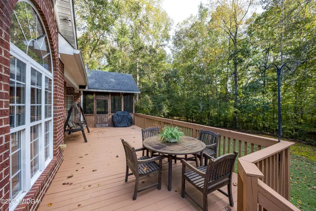 a view of a table and chairs on the roof deck