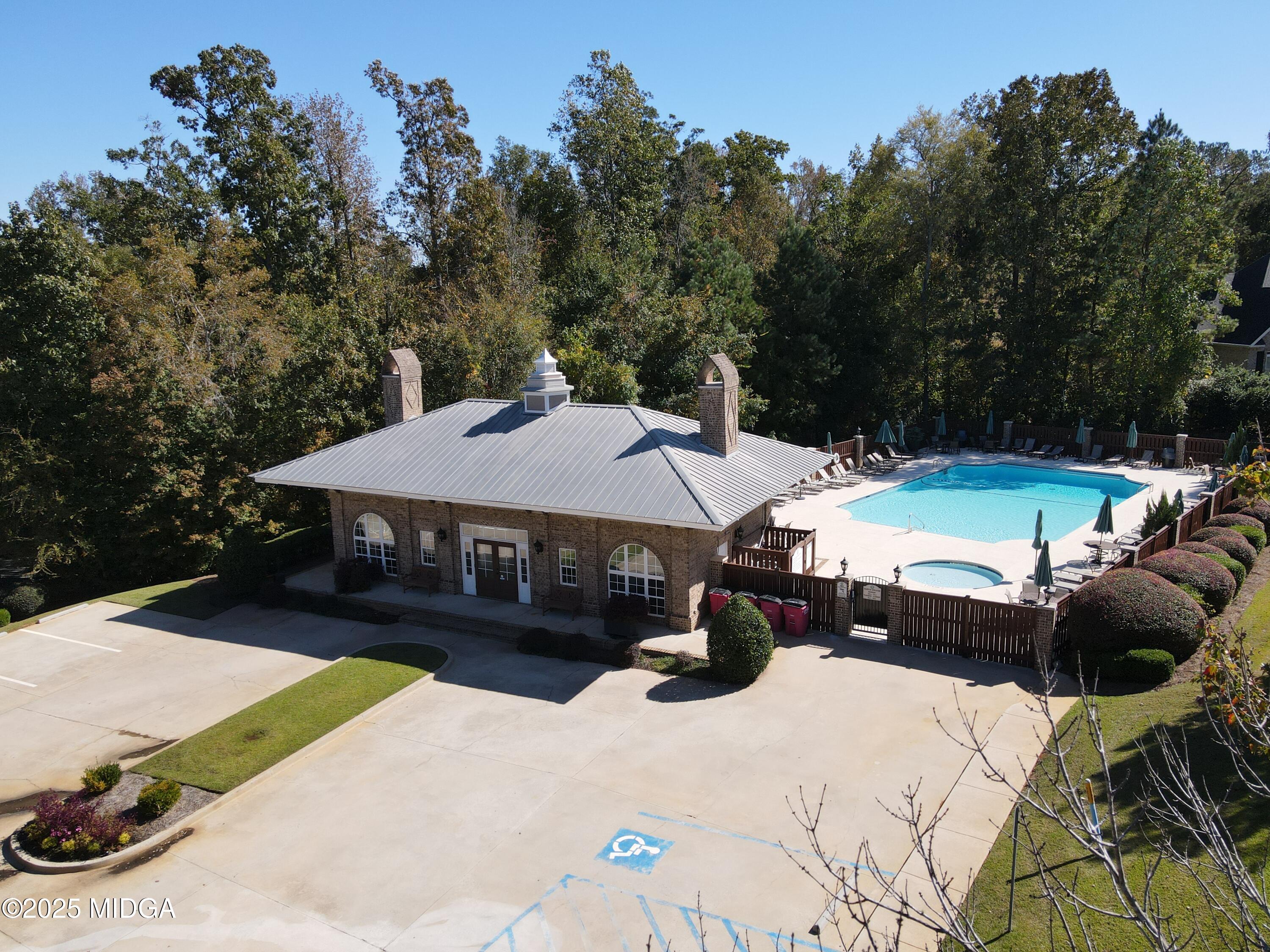 906 Huntcliffe Drive Macon, GA 31210 - Photo 4 of 5 a view of a patio with a table and chairs under an umbrella
