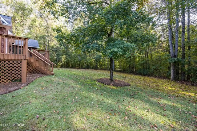 a backyard of a house with lots of green space