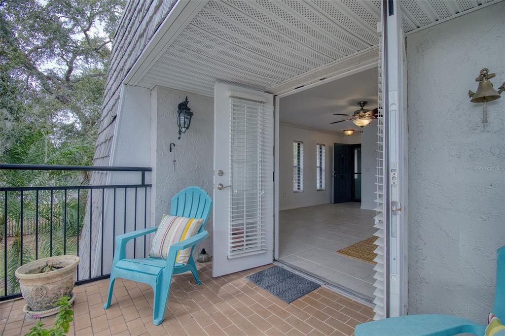 702 Lyndhurst Street, Unit 821 Dunedin, FL 34698 - Photo 17 of 30 a view of a chair in the balcony
