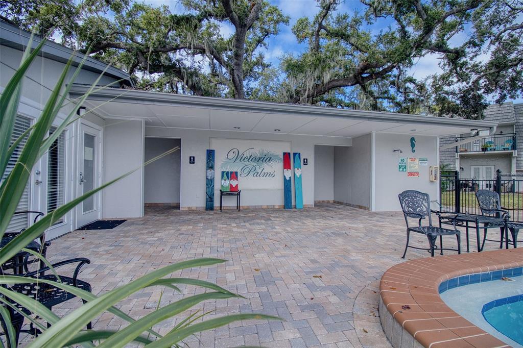 702 Lyndhurst Street, Unit 821 Dunedin, FL 34698 - Photo 20 of 30 a view of a chairs and table in the patio