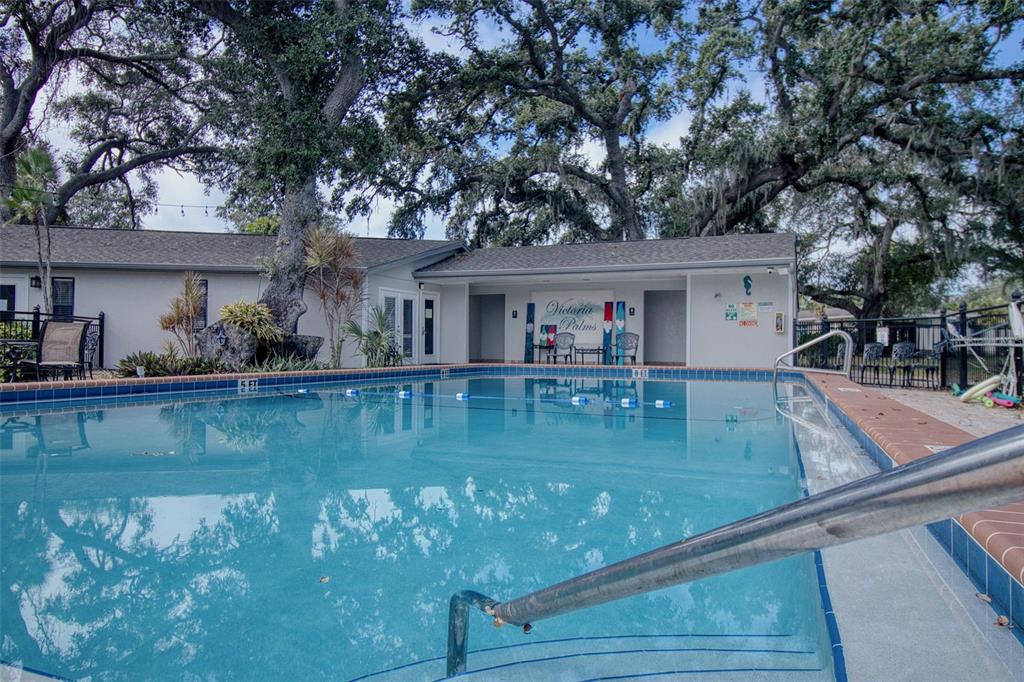 702 Lyndhurst Street, Unit 821 Dunedin, FL 34698 - Photo 22 of 30 a view of a house with a swimming pool