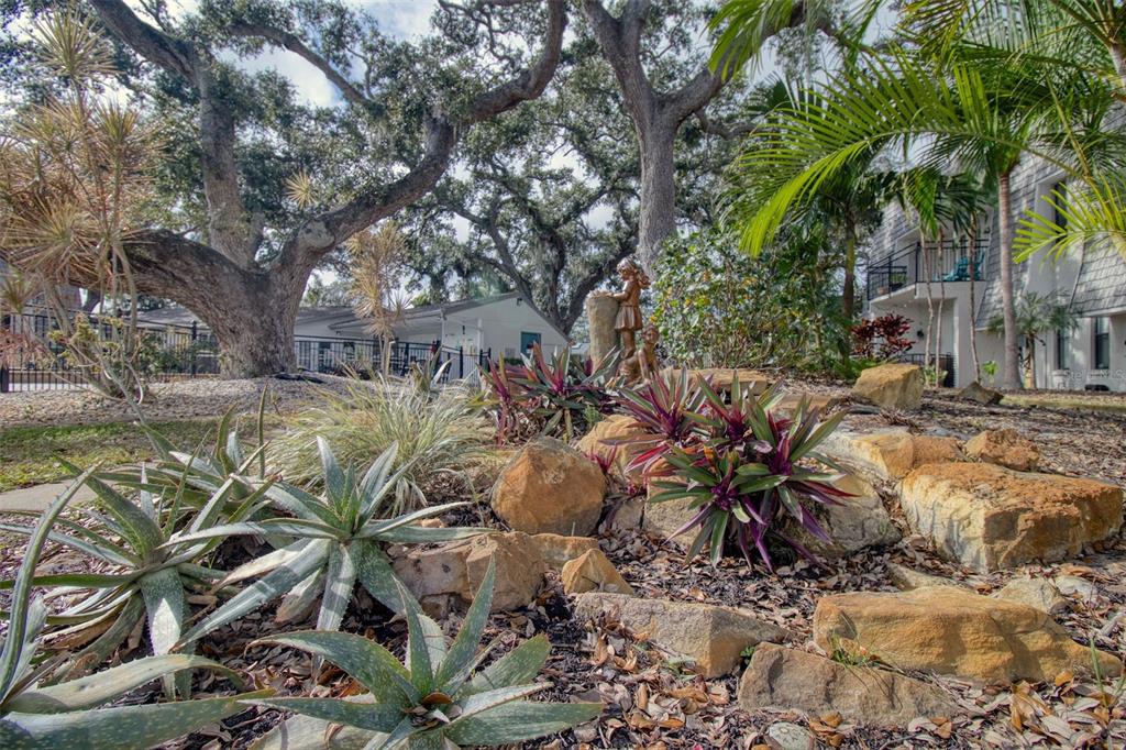 702 Lyndhurst Street, Unit 821 Dunedin, FL 34698 - Photo 30 of 30 a view of yard with swimming pool and seating space