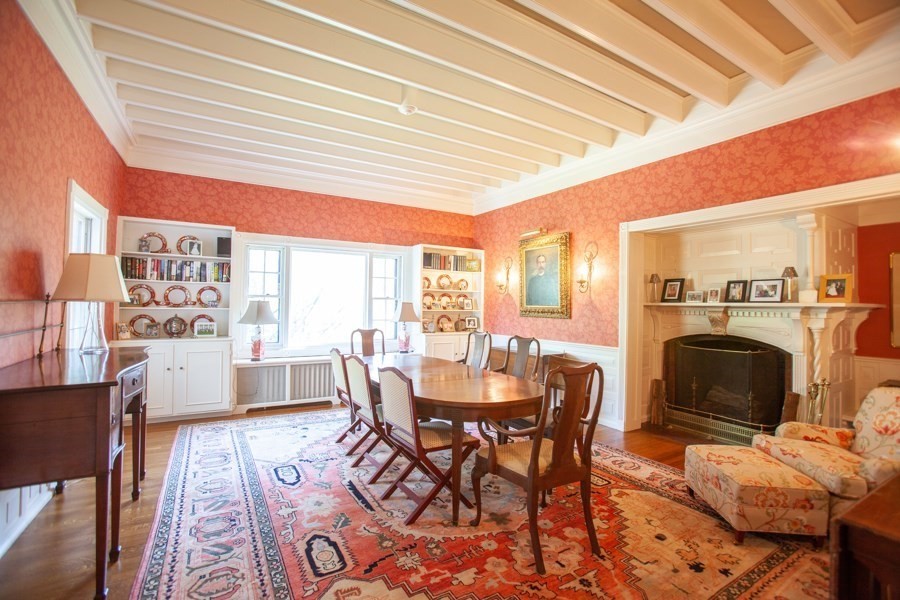 62 Pond Road Wellesley, MA 02482 - Photo 6 of 14 a dining room with furniture a fireplace and wooden floor