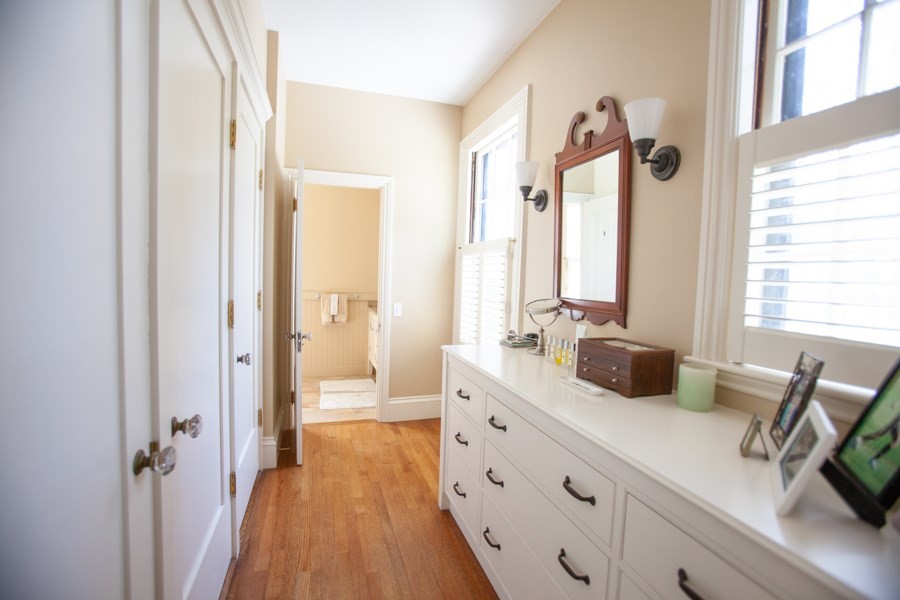 62 Pond Road Wellesley, MA 02482 - Photo 10 of 14 a bathroom with a double vanity sink a mirror and a shower