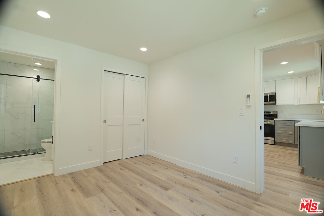 1338 West 30th Street Los Angeles, CA 90007 - Photo 9 of 21 a view of a kitchen cabinets and wooden floor