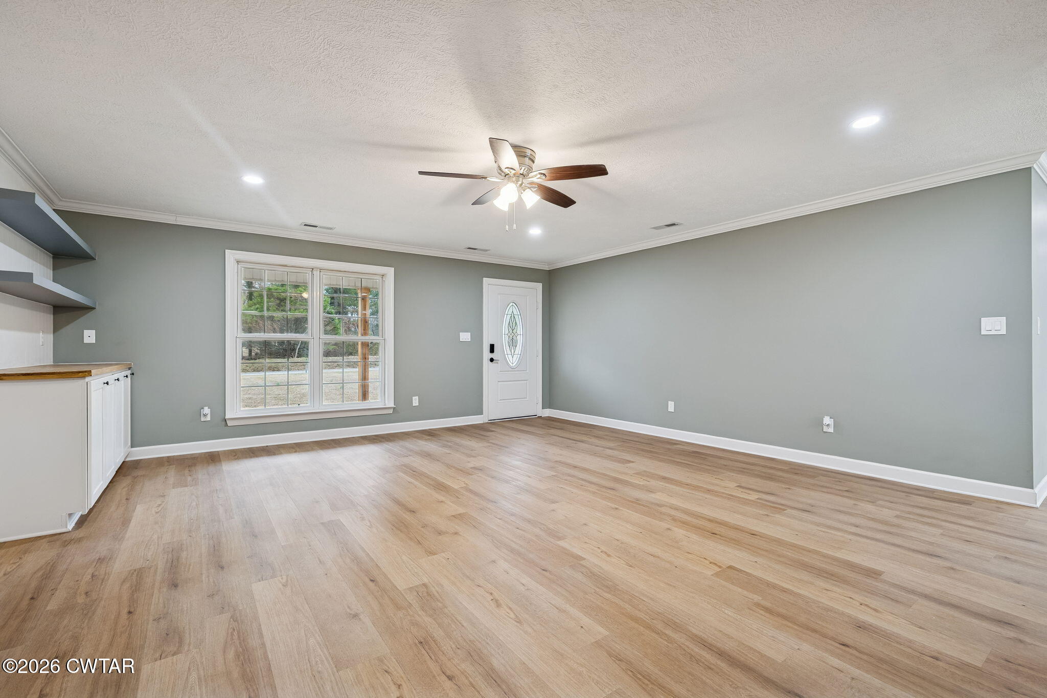 123 Walnut Hill Road Bells, TN 38006 - Photo 10 of 61 an empty room with wooden floor and windows
