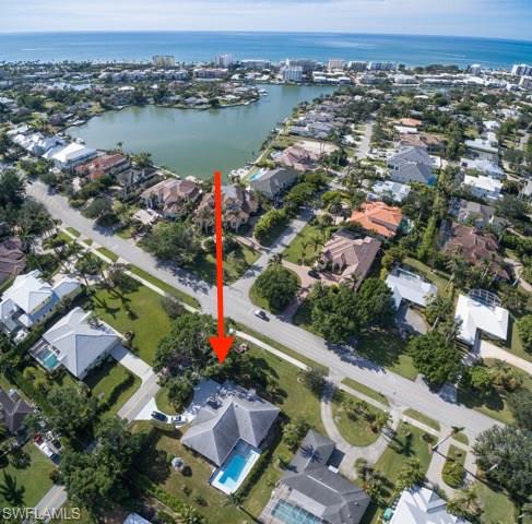 501 Springline Drive Naples, FL 34102 - Photo 1 of 14 an aerial view of house with yard and ocean view