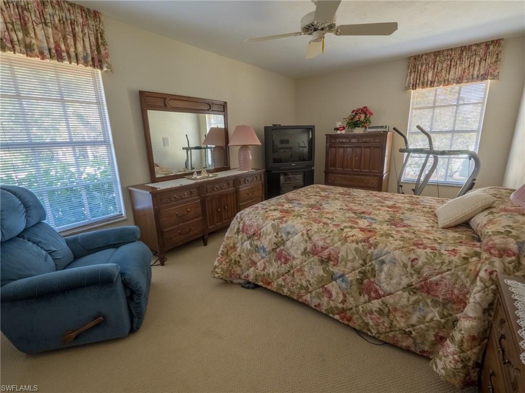 501 Springline Drive Naples, FL 34102 - Photo 11 of 14 a living room with furniture and a flat screen tv