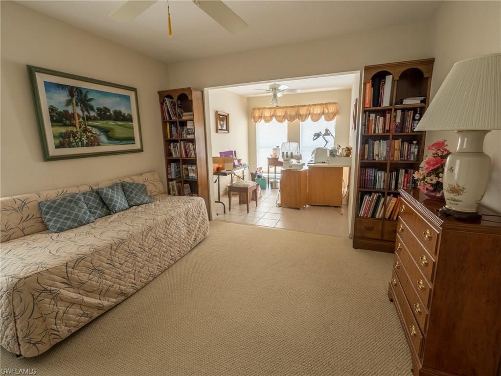 501 Springline Drive Naples, FL 34102 - Photo 12 of 14 a living room with furniture and a large window