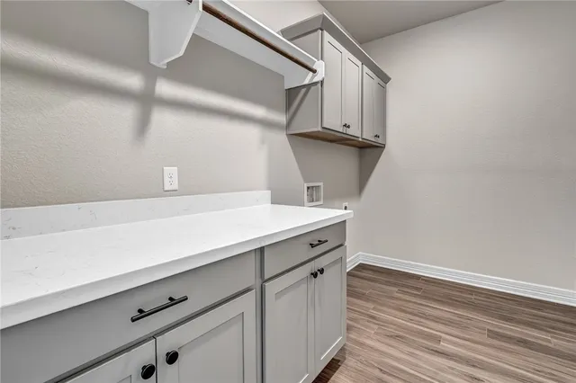 a view of cabinets with wooden floor
