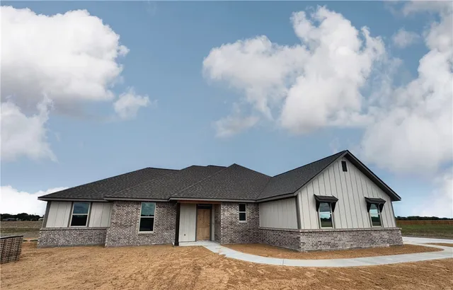 a house with trees in the background