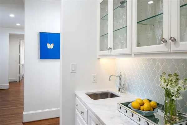 a bathroom with a tub and sink