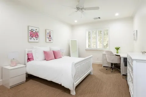 a bedroom with a bed and a table